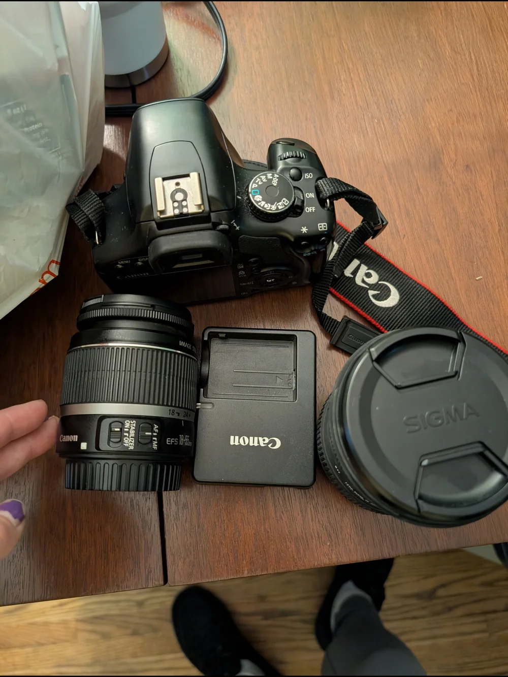 Canon DSLR Camera with Black Lenses and Charger